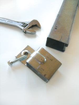 The box rail attaches to the wall with box rail brackets. The brackets attach to the wall with a wood box.
